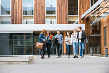 students outside building